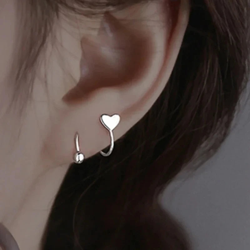 Twist Heart – Trendige Spiral-Ohrstecker aus Edelstahl